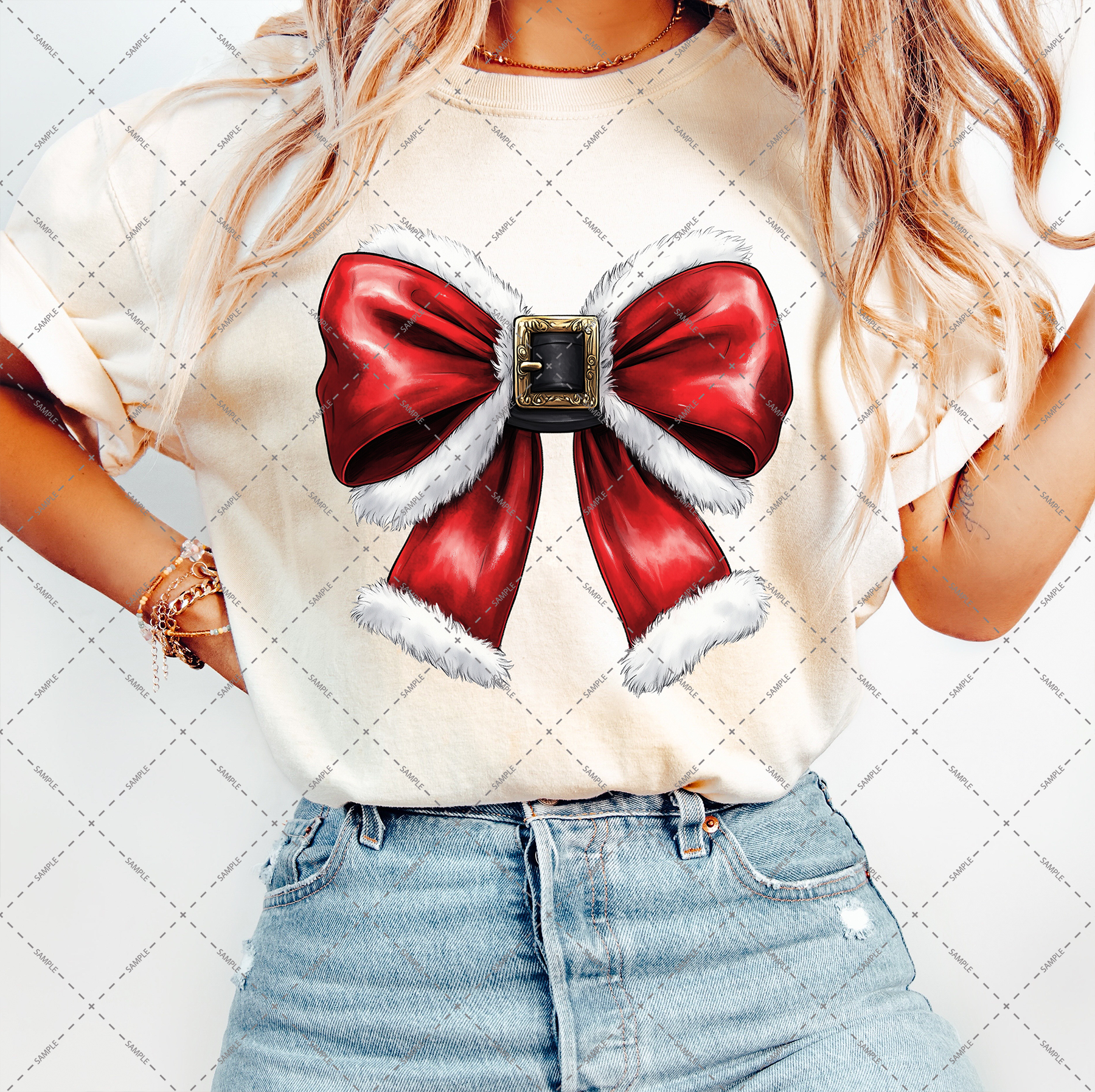 A person in a beige T-shirt adorned with a prominent red bow trimmed with white fur and featuring a decorative buckle is matched with light blue jeans. Their long, wavy hair adds harmony to the ensemble as they pose against the transparent background of the Christmas Coquette Bow PNG file.