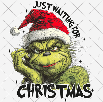 A cheeky green figure dons a red and white Santa hat, flashing a sly smile on a clear backdrop. Surrounding text says "Just Waiting for Christmas," making it an ideal download option for the high-quality PNG file, "Just Waiting for Christmas Transparent PNG File.