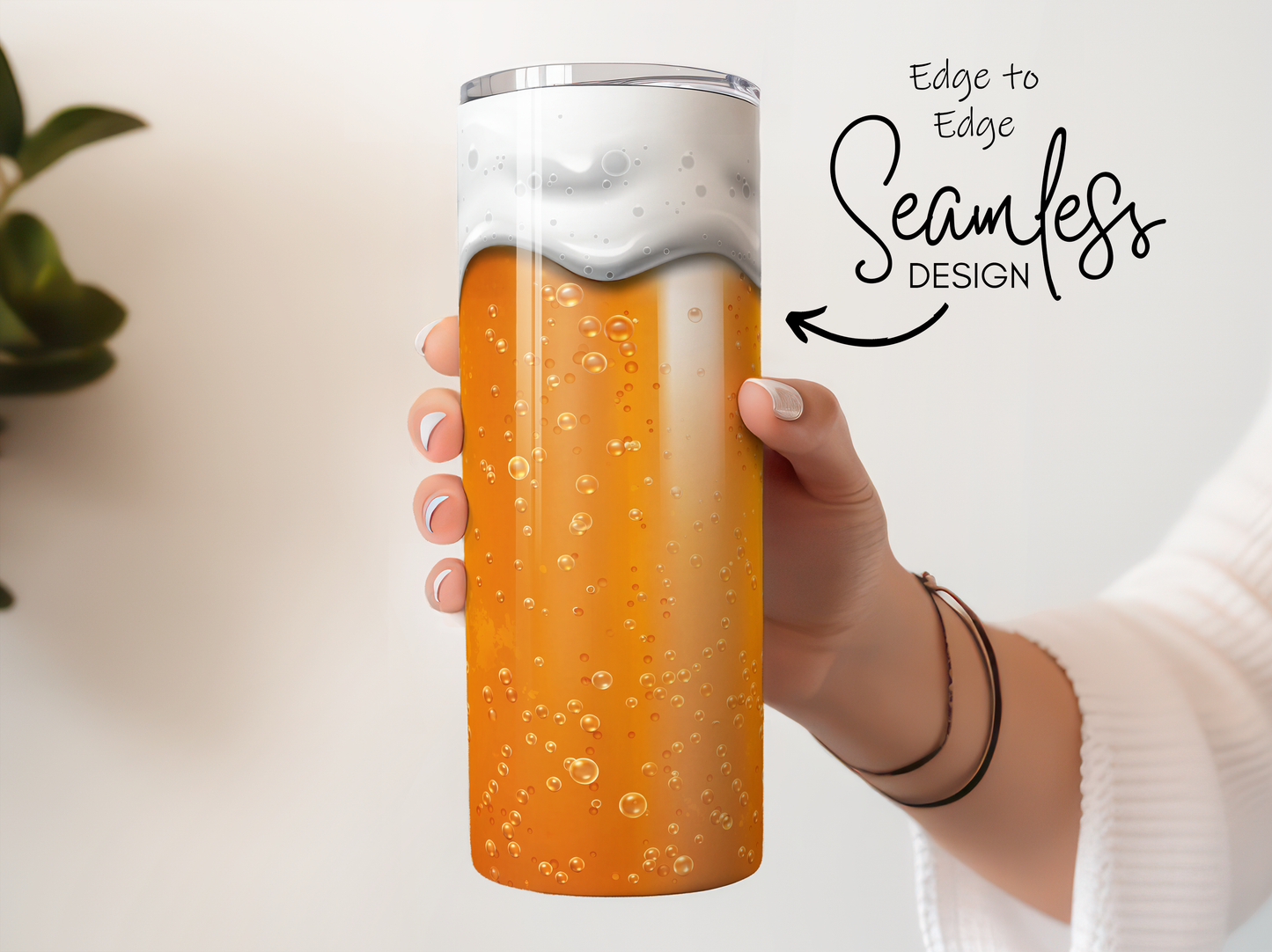 Woman holding a seamless design orange soda tumbler with foam.